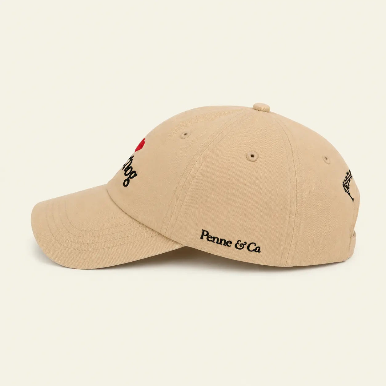 Side view of the I Love My Dog baseball cap with embroidered Penne & Co detail